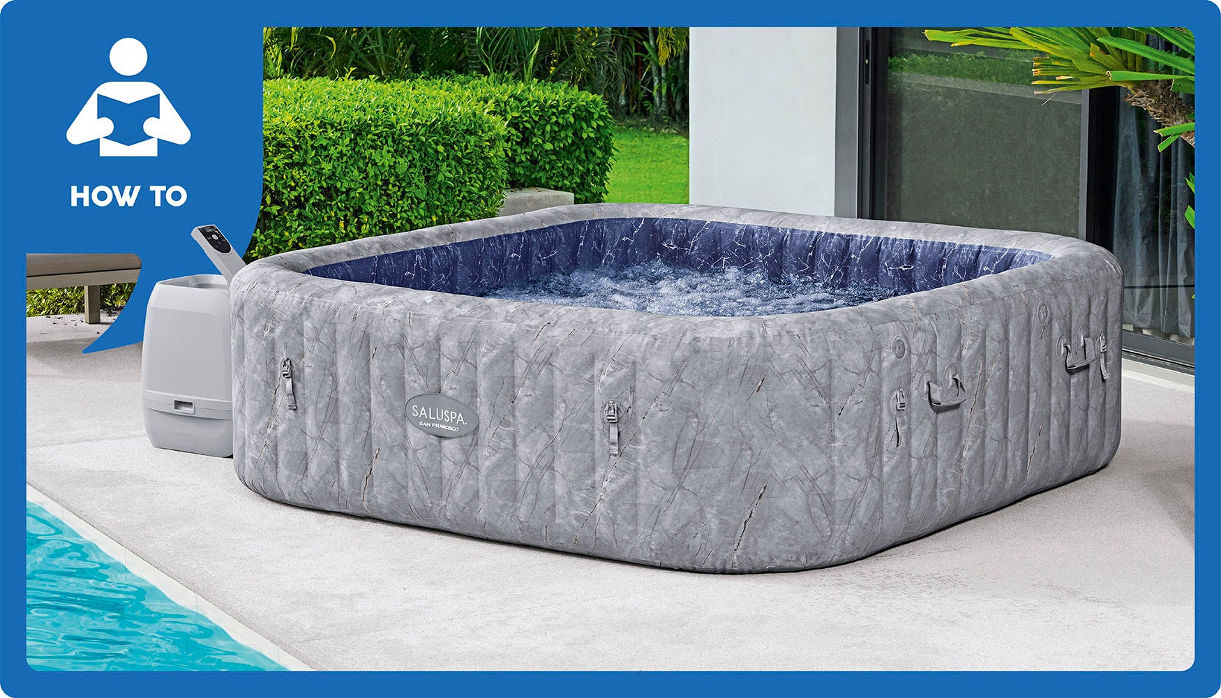 A gray SaluSpa Boracay inflatable hot tub – filled with warm, bubbling water – sitting on a patio.